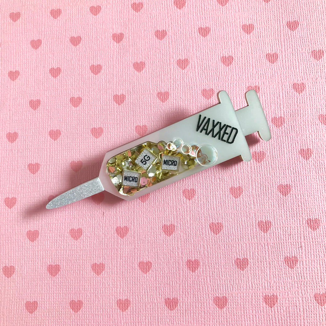 VAXXED Syringe Brooches in silver and gold glitter