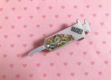 Load image into Gallery viewer, VAXXED Syringe Brooches in silver and gold glitter
