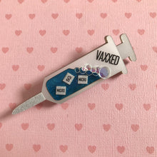 Load image into Gallery viewer, VAXXED Syringe Brooch in Silver and Blue Marble
