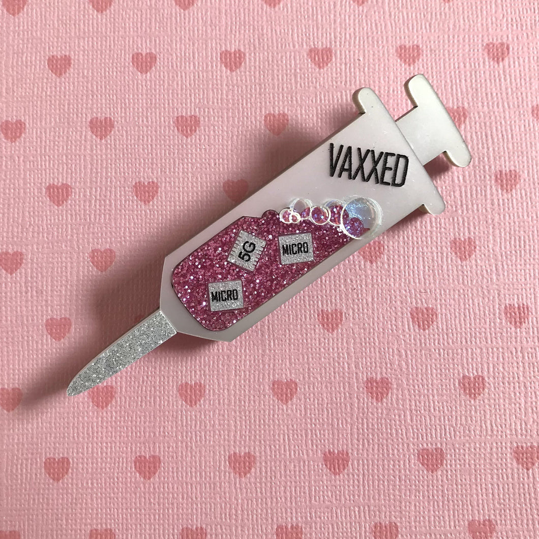 VAXXED Syringe Brooches in Silver and Pink Glitter